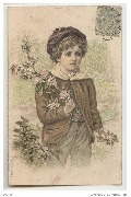 Enfant tenant une branche de pommier en fleur en main