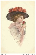 Jeune femme respirant une rose, avec un chapeau de paille noir