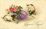 Deux chiens d&eacute;nouant un oeuf rose. Joyeuses P&acirc;ques