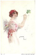 Femme peignant un tr&egrave;fle &agrave; quatre feuilles