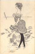 femme debout en robe pieds dans l'eau face à la mer