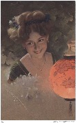 Femme avec une lanterne japonaise orange
