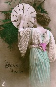 Bonne Année (jeune femme en robe de mousseline place l'aiguille à minuit)
