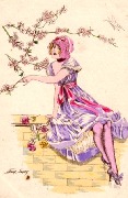 Sur le mur elle prend une branche d'un arbre fruitier en fleur
