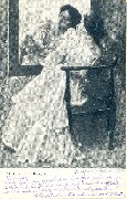 Femme assise devant un miroir